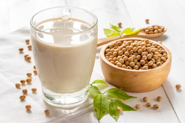 soya beans and soya milk in a glass